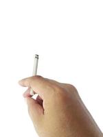 A cigarette in a hand, isolate hand and cigarette, cigarette white background photo