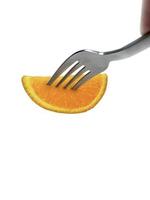 Orange fruit on fork isolated white background photo