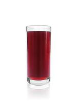Pomegranate juice in a glass. Isolated on white background photo