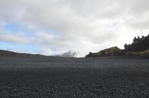 View of Scenic Snow Capped Mountains from Black Sand Beach photo