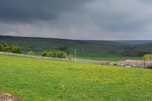 Dark Storm Clouds Over Farmland in England photo