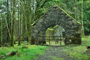 Beautiful lush countryside with a old scottish stone building photo