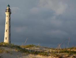 Sun Shining on the Lighthouse in Aruba photo