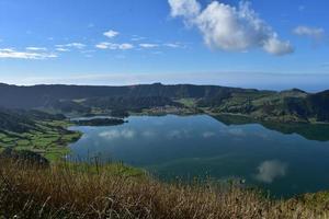 Hills and Clouds Reflecting in a Lake Caldeira photo