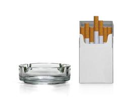 Cigarette pack and ashtray isolated on white background photo