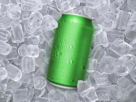 Can of cold beverage, ice cubea of juicy. Summer refreshing drink photo