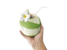 Male hand with a coconut on white background photo