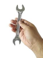 Wrench and hand with white background. Craftsman tool photo