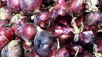 Natural background with red onion bulbs photo