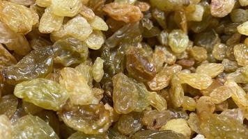 Natural background with dried yellow golden raisins photo