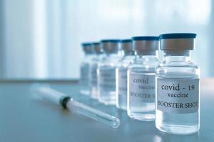 COVID-19 booster vaccine vial. Medicine and health care concept photo