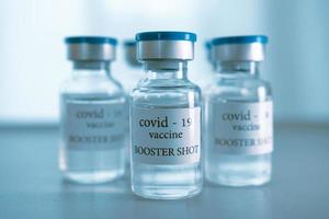 COVID-19 booster vaccine vial. Medicine and health care concept photo