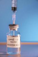 COVID-19 booster vaccine vial. Medicine and health care concept photo