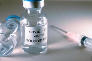 COVID-19 booster vaccine vials. Medicine and health care concept photo