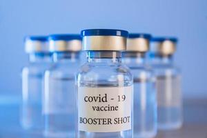 COVID-19 booster vaccine vials. Medicine and health care concept photo