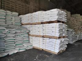 Chemical fertilizer The product stock is packed in sacks, stacked in the warehouse, waiting for delivery. photo