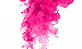 Pink color paint in water photo