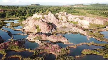 Aerial view quarry with blue water surrounded by large rock video