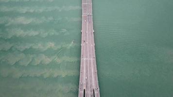 Aerial view boat and car traffic near Penang Bridge. video