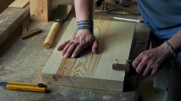 woodworker marks the workpiece with the help of a miter and a pencil video