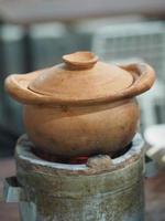 Hot pot Clay pot on charcoal stove photo