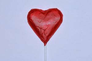 Chocolate heart on a white background. photo