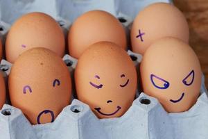 Emotion of fresh eggs  on a straw. photo
