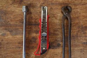 Old tools on a wooden table photo