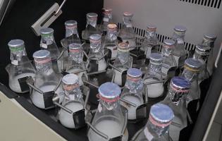 Lab bottles shaking liquid tissue microbial culture photo