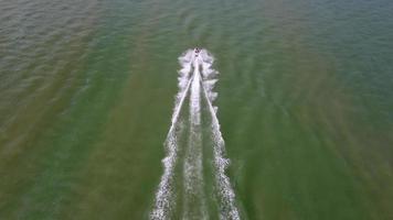 Aerial top down view fishing boat move video