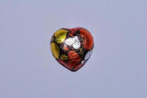 Chocolate heart on a white background. photo