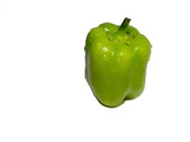 Dolma pepper on a white background. A juicy beautiful vegetable. Green sweet pepper. photo