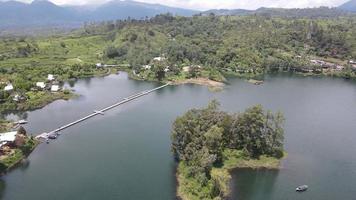 Aerial view of lake side with park and mountain in Bandung, Indonesia video