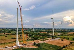 Panoramic view of wind farm or wind park, in the meadow field  are one of the cleanest, renewable electric energy source. with high wind turbines for generation electricity. Green energy concept. photo