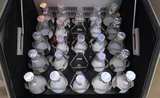 Lab bottles shaking liquid tissue microbial culture photo