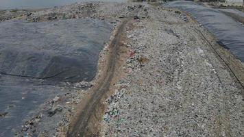 Aerial view over huge pile of garbage or waste waiting for recycle or for produce electrical in electrical power plant. Sustainable energy environment conservation concept. video