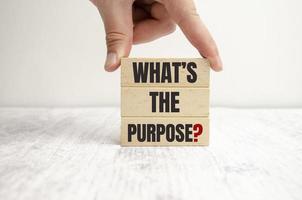 WHAT IS THE PURPOSE text on wooden block photo