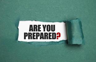 The text Are You Prepared Question appearing behind torn blue paper photo