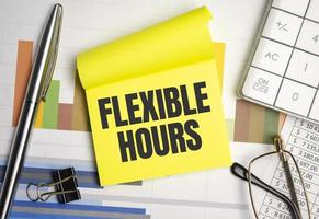 yellow sticker with the text FLEXIBLE HOURS and charts photo