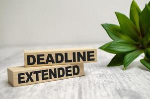 two wooden blocks with the words dEADLINE EXTENDED photo