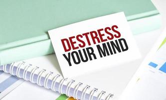 destress your mind words on notepad and charts photo