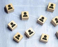 Wooden blocks on blue background. Teamwork, network and community concept. photo