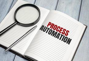PROCESS AUTOMATION text on diary and magnifier photo