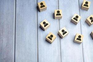 Wooden blocks on blue background. Teamwork, network and community concept. photo