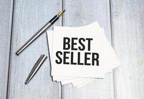 best seller text write on white paper photo