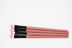 Makeup brushes on white background photo