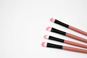 Makeup brushes on white background photo