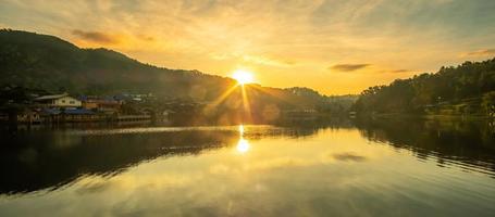 Beautiful of lake view in the morning sunrise, Ban Rak Thai village, landmark and popular for tourists attractions, Mae Hong Son province, Thailand. Travel concept photo