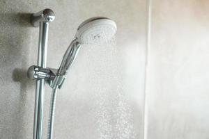 shower head with wall background in modern bathroom photo