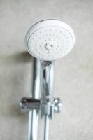 shower head with wall background in modern bathroom photo